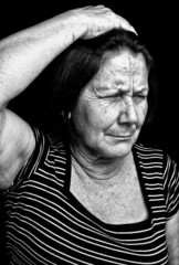 Wall Mural - Grunge portrait of an old woman with a headache