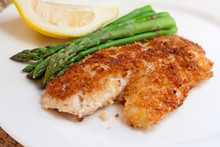 Fried Breaded Fish With Asparagus And Lemon