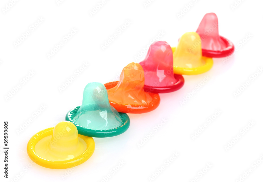 Colorful condoms isolated on white