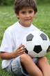 © auremar - Little boy holding football