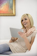 © mangostock - woman reading an ebook on her digital tablet