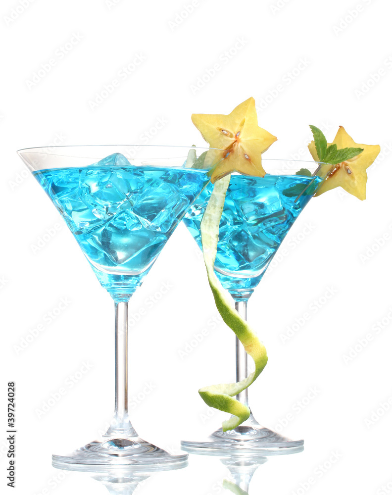 Blue cocktail in martini glasses with ice isolated on white