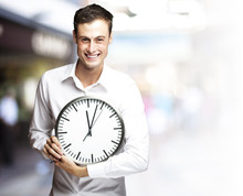 Man Holding Clock