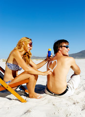 Wall Mural - suncare beach couple