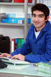 © auremar - Young apprentice doing paperwork.