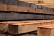 Timber stacked and the sawmill