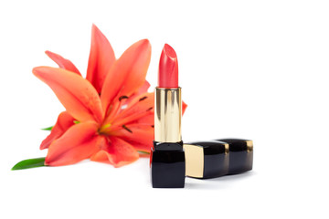 New lipstick and lily flowers, isolated on white background