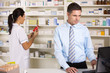 © Monkey Business - UK nurse and pharmacist working in pharmacy