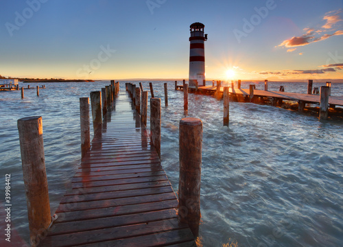 Naklejka na drzwi Lighthouse at Lake Neusiedl at sunset