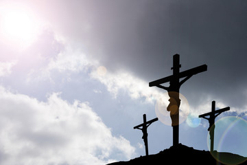 three crosses beneath stormclouds