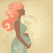Silhouette of pregnant woman in flowers