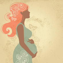 Silhouette Of Pregnant Woman In Flowers
