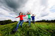 © Jacek Chabraszewski - Active family - mother and kids jumping outdoor