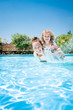 © Sunny studio - Happy child playing with mother in pool
