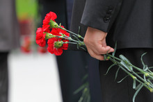 Bouquet Of Red Carnations In Man Hand At Victory Day Celebration
