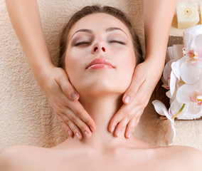 Spa Massage. Young Woman Getting Facial Massage