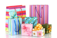 Bright Gift Bags And Gifts Isolated On White
