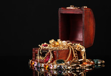 Wooden Chest Full Of Gold Jewelry On Black Background