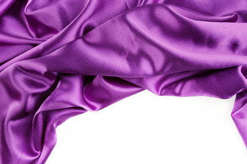 Rippled purple silk fabric on white. Copy space