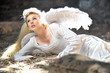 © Aarrttuurr - Beautiful angel woman lies in theatre