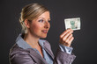 © mathom - Woman with polish zloty money on dark gray background
