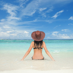 Wall Mural - Young fashion woman on the beach