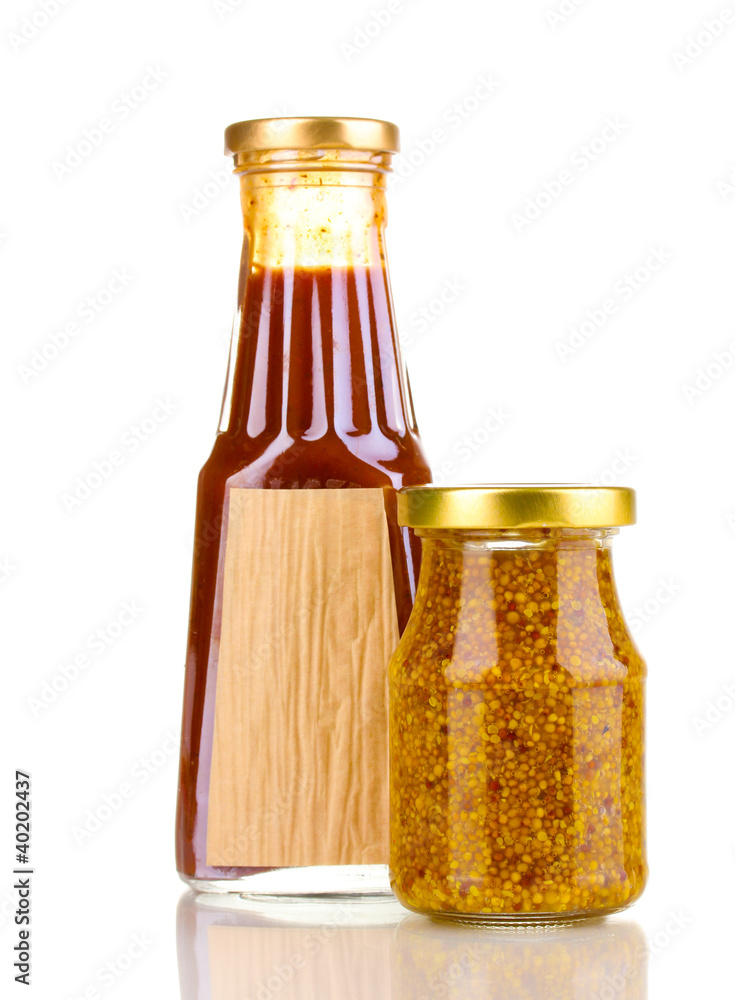 Tomato sauce and mustard in glass bottles isolated on white