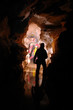 Cavers exploring a gallery in a cave