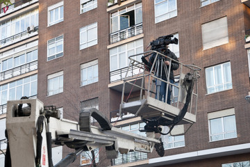 Cameraman working on an aerial work platform