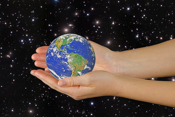 Wall Mural - planet earth on palms.elements of this image furnished by nasa