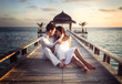© XtravaganT - Sensual happy couple with white clothes on a pier (Maldives)