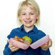© Karin & Uwe Annas - Cute girl shows her sandwich eaten during break