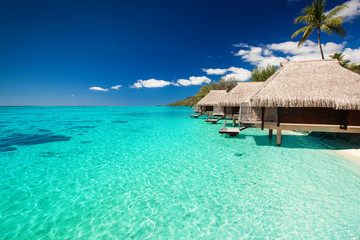 Wall Mural - villas on the tropical beach with steps into water