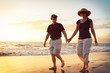 © EpicStockMedia - Senior Couple Enjoying Sunset at the Beach
