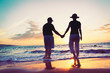 © EpicStockMedia - Senior Couple Enjoying Sunset at the Beach