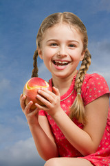 Lovely girl with red apple