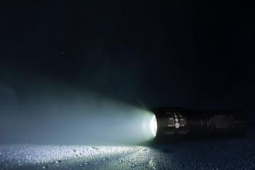 Tactical waterproof flashlight with waterdrops and smoke