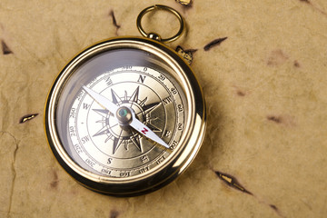 old style compass and paper background