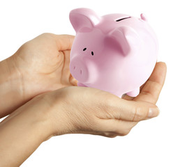 woman hand holding a piggy bank. Isolated on white