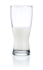 Wall Mural - Half a glass of fresh milk isolated on a white background