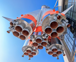 Wall Mural - details of space rocket engine over blue sky background