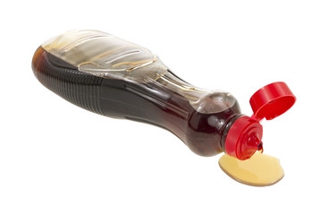 syrup spilling from bottle