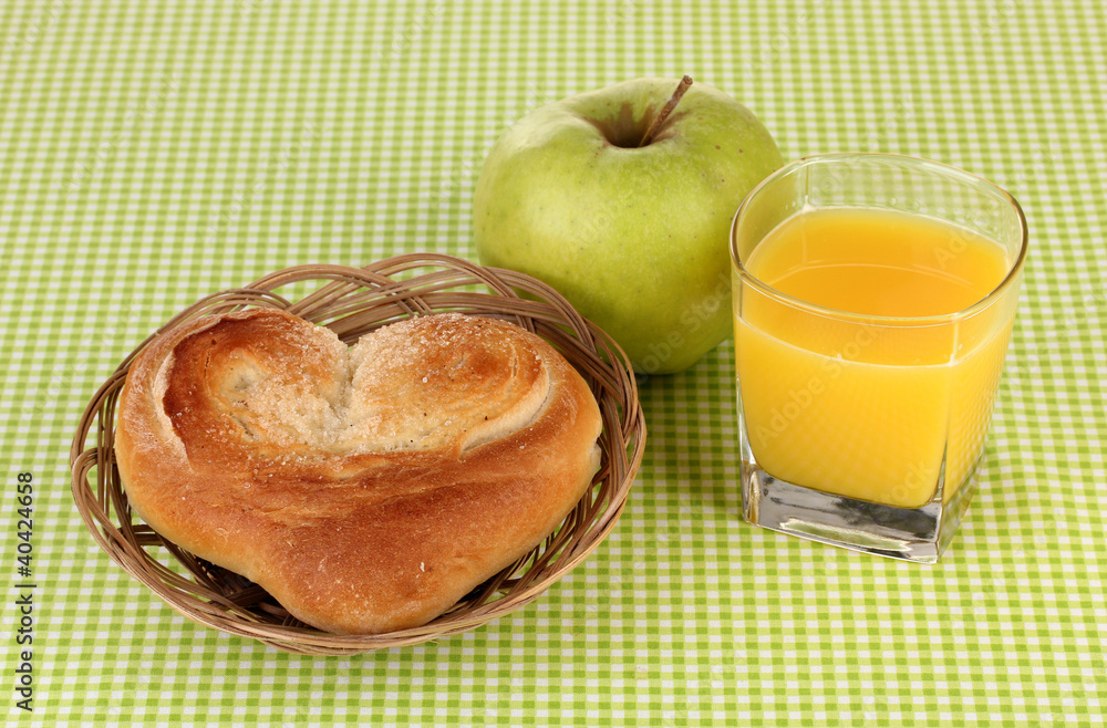 Classical breakfast. Orange juice and bun