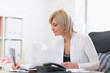 © Alliance - Senior business woman at work