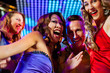 © Kzenon - Party people dancing in disco or club