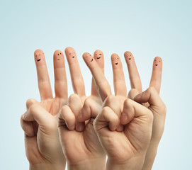 Group of finger smileys with social chat sign and speech bubbles