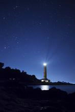 Lighthouse And Stars At Night