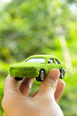 Fototapete - Hand Holding Eco car icon concept
