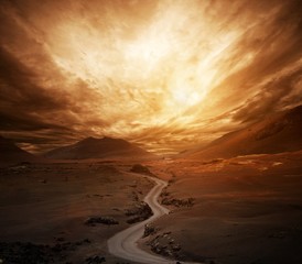 Dramatic sky over road in a valley.