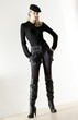 © Richard Semik - standing woman wearing fashionable boots